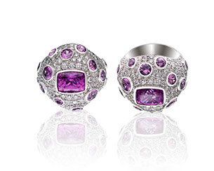 Ring with many small white gems surrounding larger purple gems